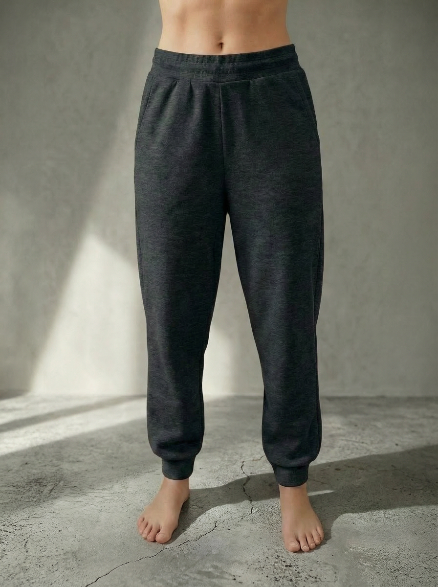 Front view of Deryn Jogger from Bou Clothing in Balck Marl colour against a stone grey background.
