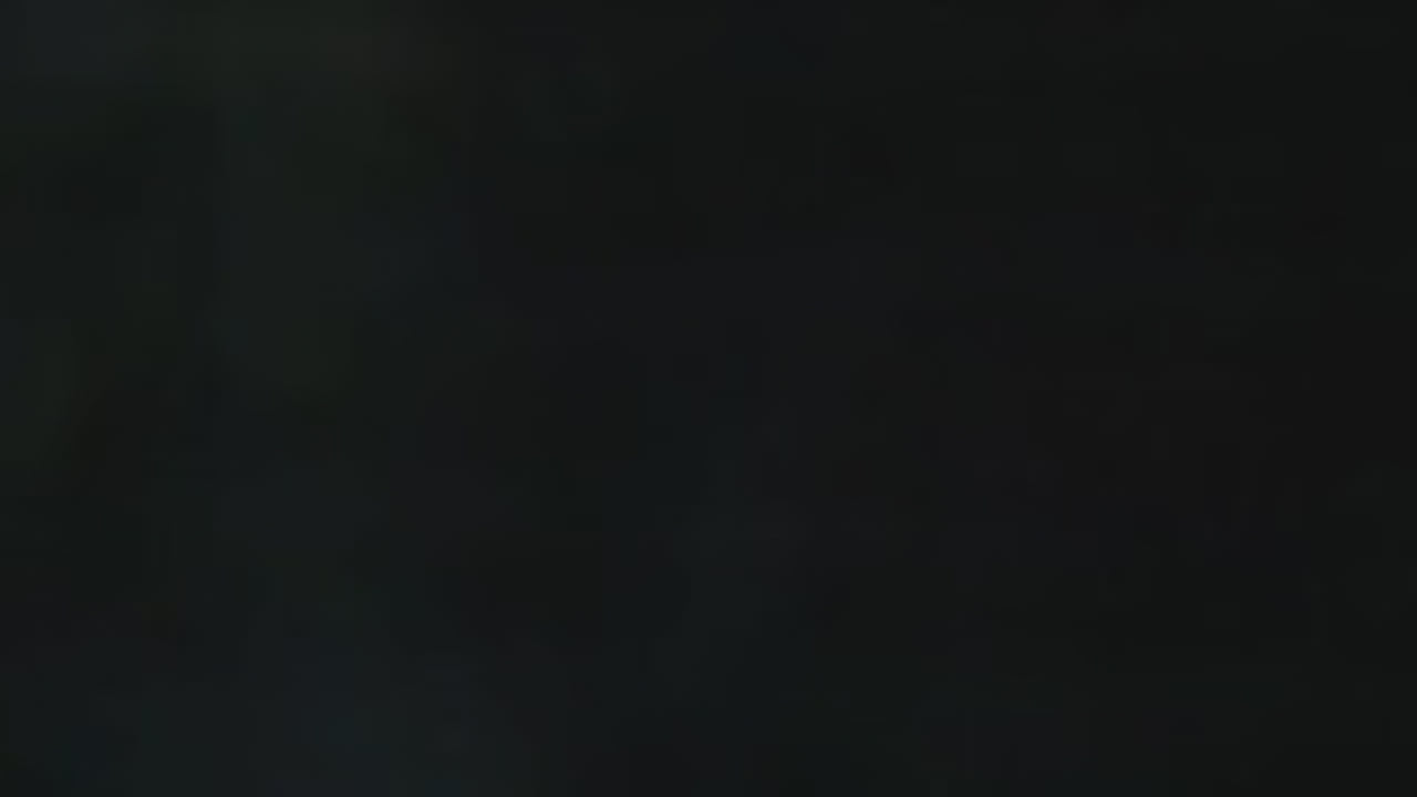 A woman walking in the countryside wearing Bou Clothing Black Deryn Hoodie and Joggers